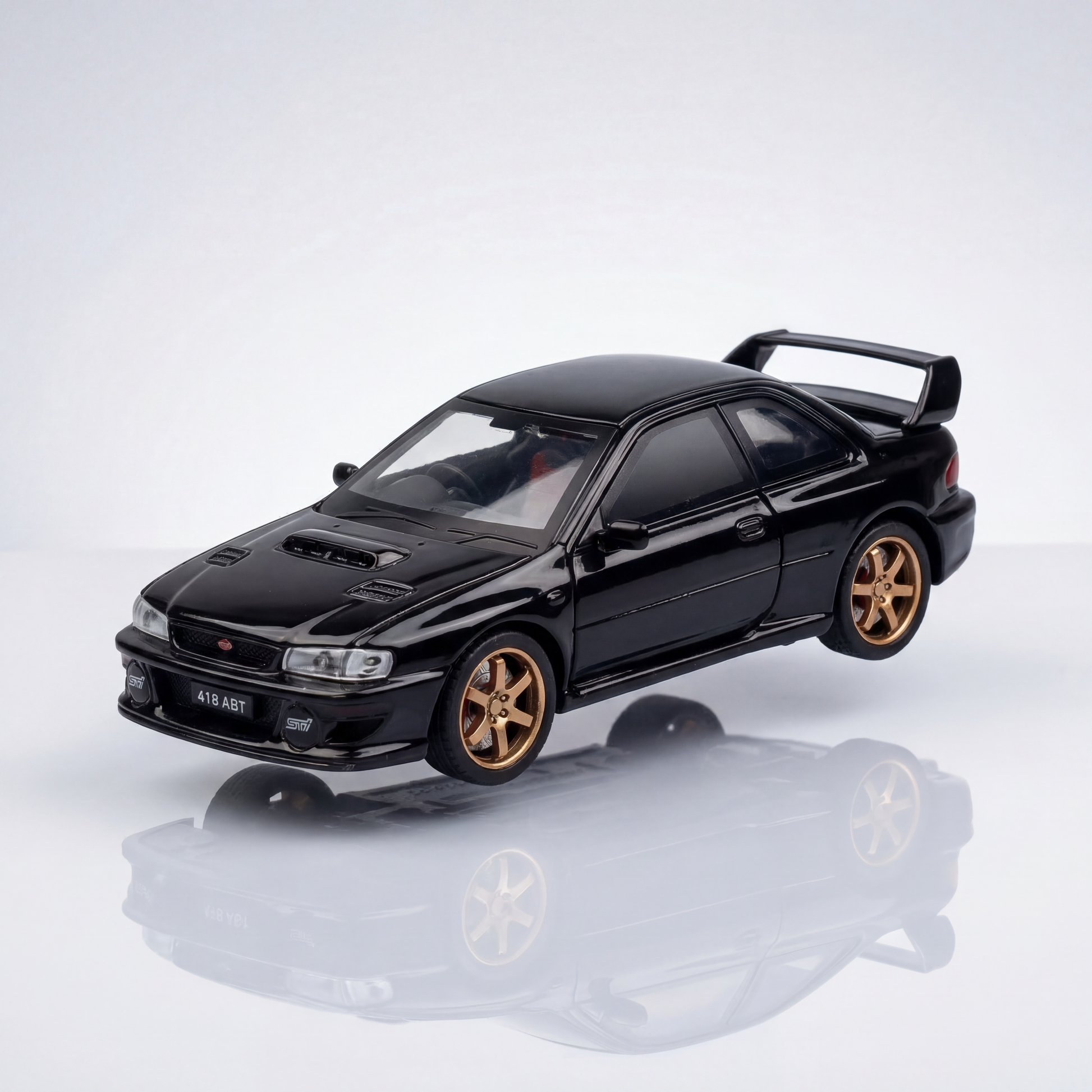 Subaru Impreza 1 36 scale diecast rally model with gold wheels and blue finish